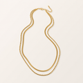 Collier Névya double chaîne doré sur fond ivoire Aliara